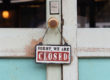 Sign on door saying Sorry, We are CLOSED