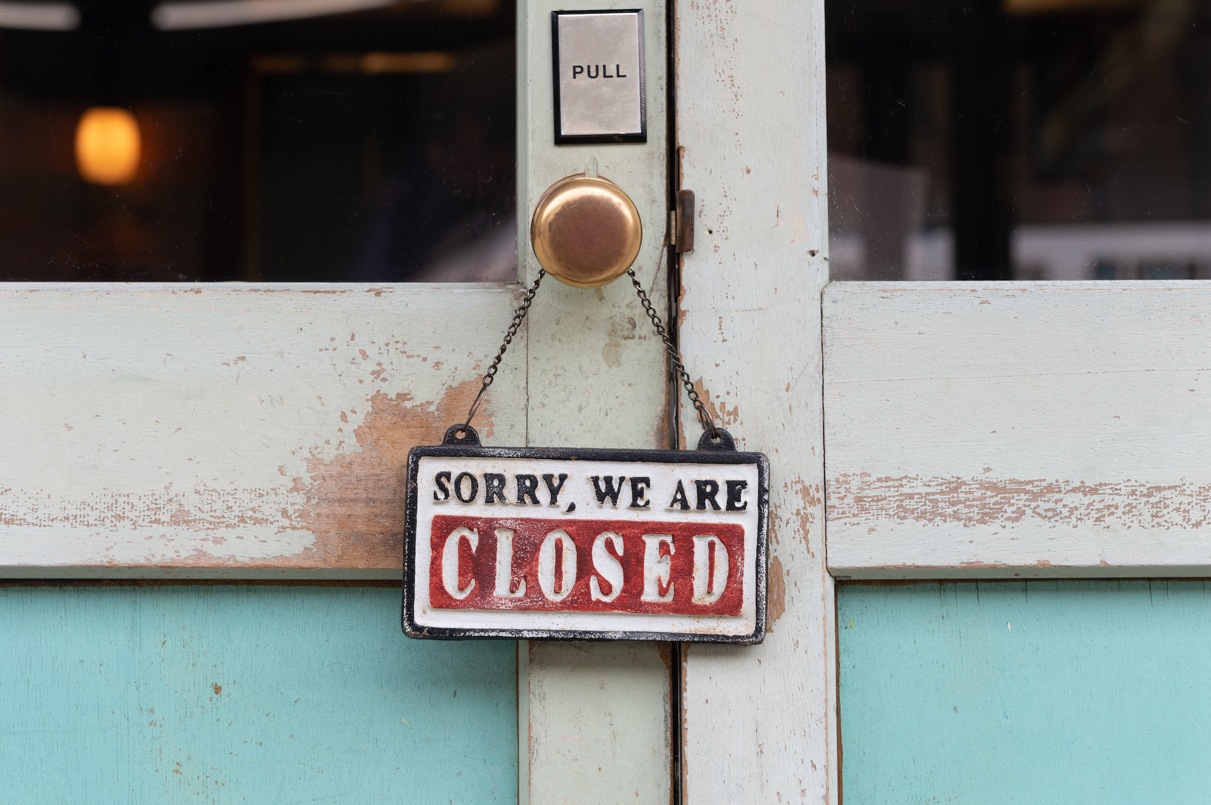 Sign on door saying Sorry, We are CLOSED