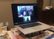 Computer with Zoom conference call on screen