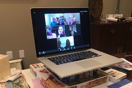 Computer with Zoom conference call on screen