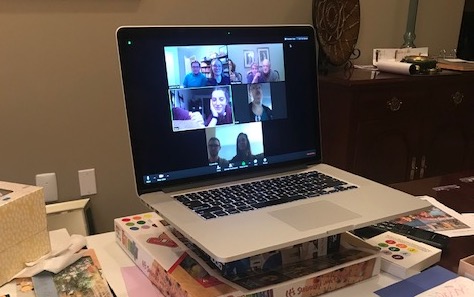 Computer with Zoom conference call on screen